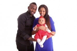 Portrait of a young african american couple with her baby girl